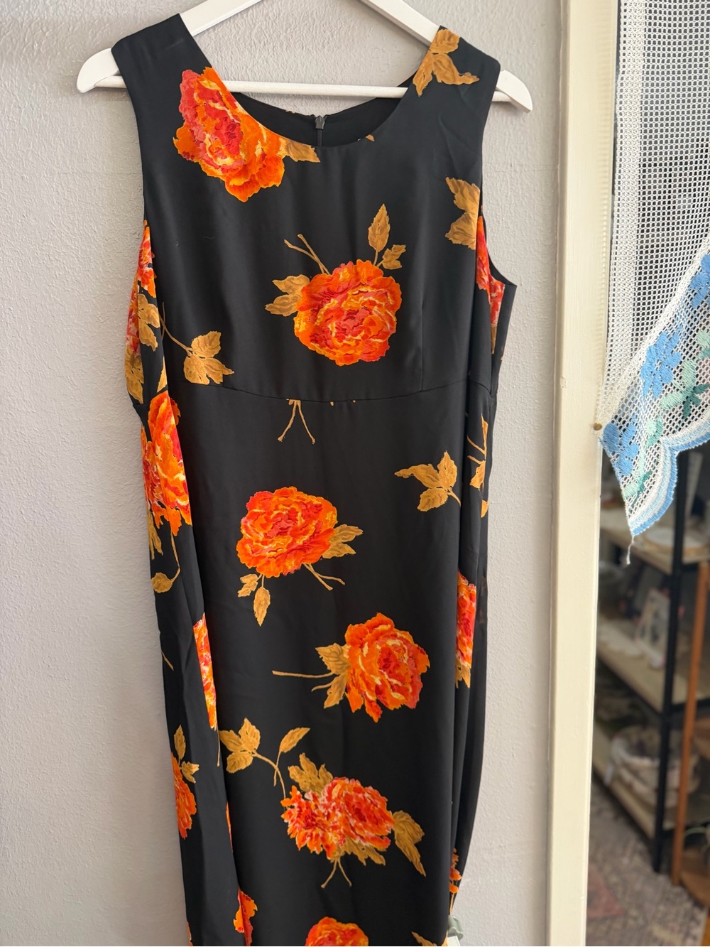 Sleeveless Black Midi Dress with Vibrant Orange Floral Print